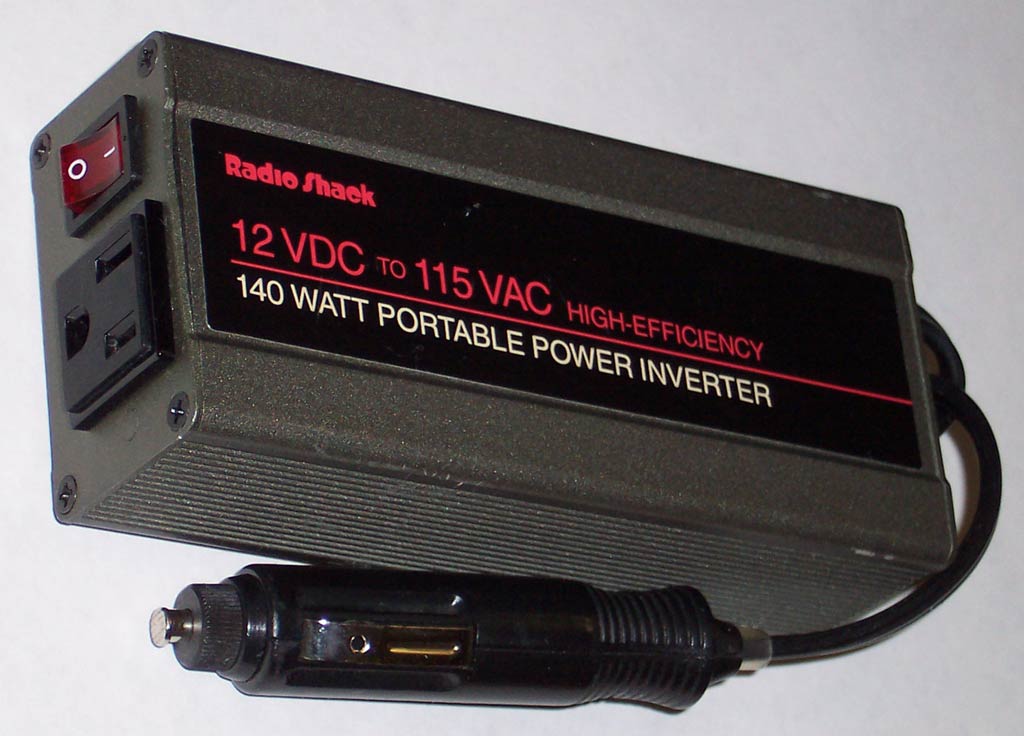 Inverter designed to provide 115 V AC from the 12 V DC source provided in an automobile. The unit shown provides up to 1.2 amperes of alternating current, or enough to power two 60 W light bulbs.