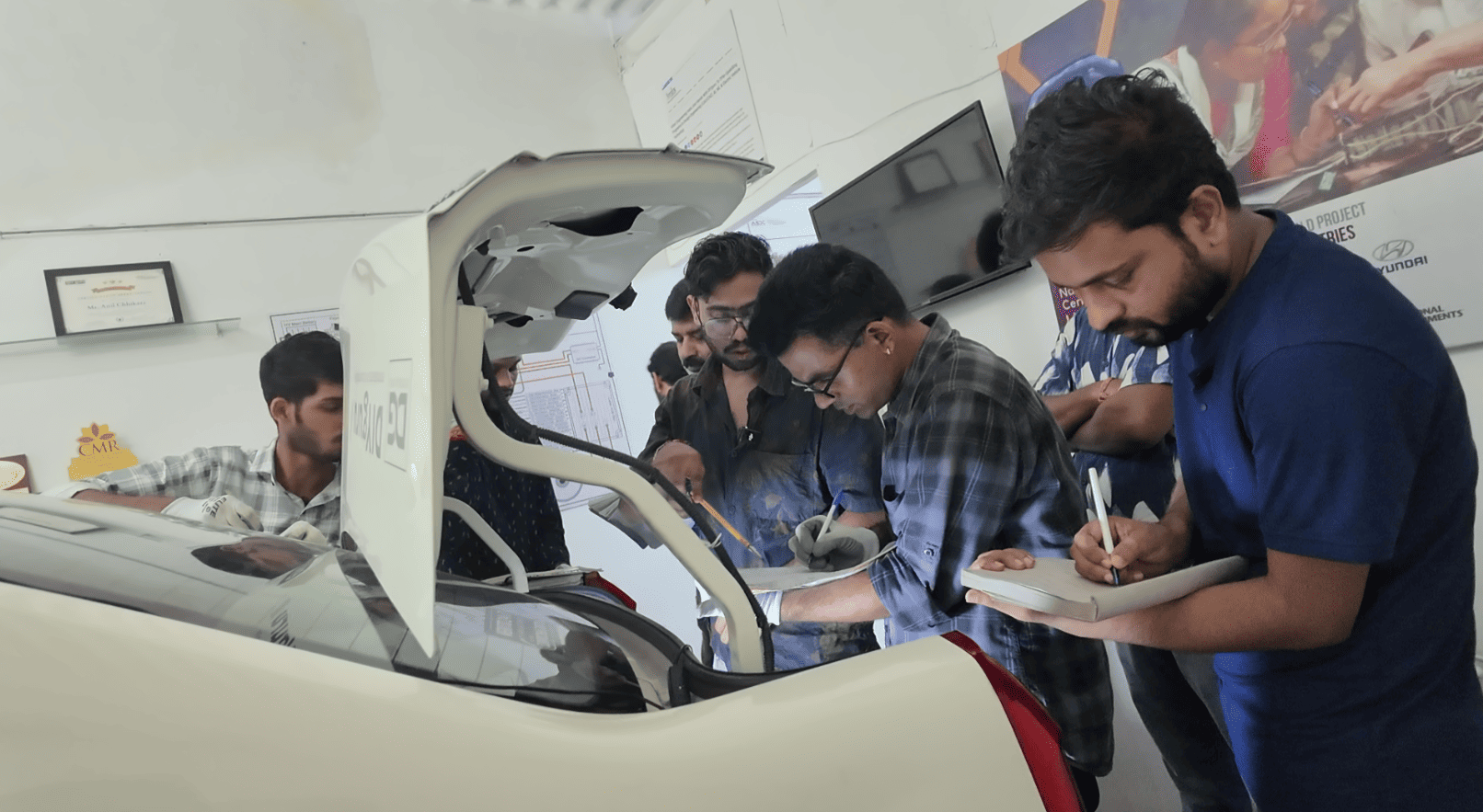 Students inspecting 4-wheeler BMS
