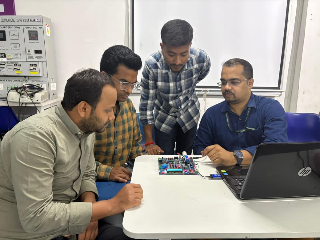 Students studying EVSE BMS board